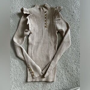 Long sleeve turtleneck sweater with faux gold buttons